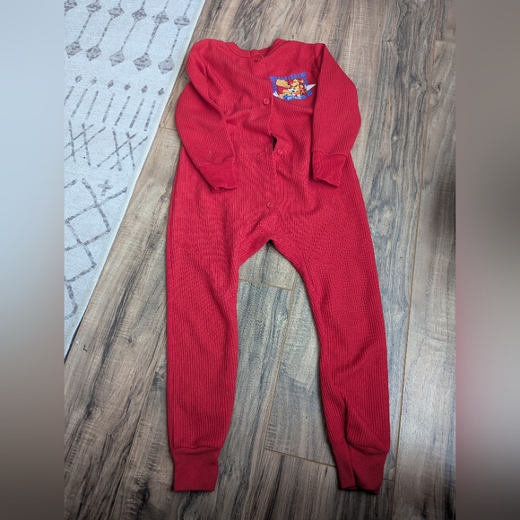 Vintage pooh X Disney open foot onesie with button front.